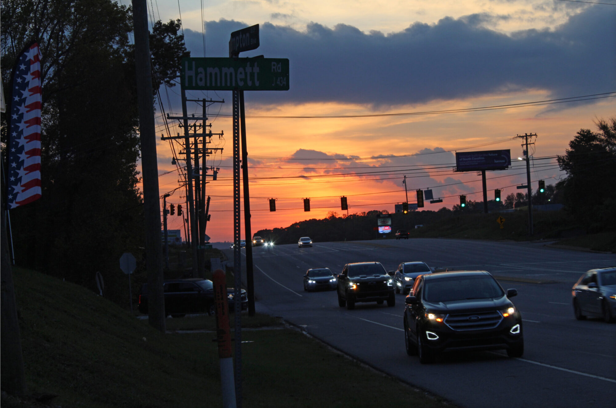 Photo of cars on the road at sunset